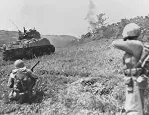 Honorable: Flame throwing Marine tank and riflemen moving