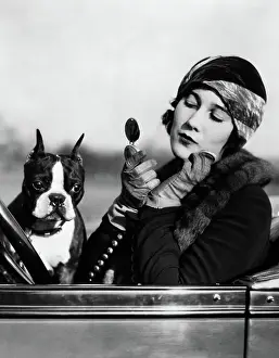 Twenties Style: Flapper in convertible powdering her face