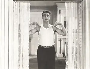 Flexing: Flexing his muscles