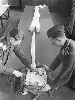 Fold: Folding up a parachute in the parachuting school in Stendal