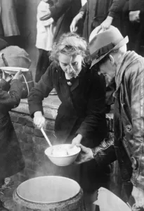 Distributes: Food distribution to bomb victims, 1944
