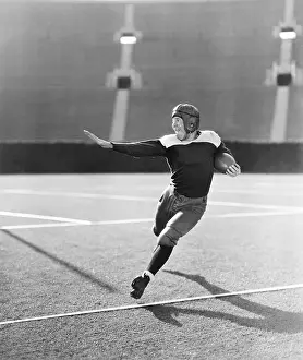 Strive: Football player running with ball