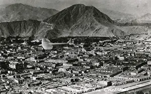 Cristobal: A Ford Panagra plane flies over Lima, Peru