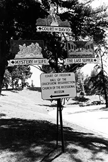 Signposts: Forest Lawn cemetery illustrated signposts, Ca, USA