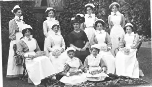 Infirmary: Formal group of ten nurses with collecting boxes, and lady