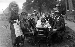 Teacups: Formal outdoor tea party at a long table