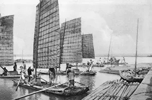 Rafts: Formosan men aboard their boats