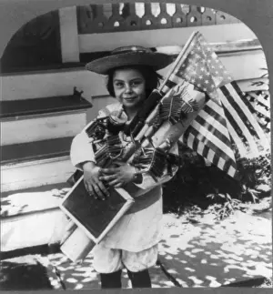 Overload: The Fourth of July, child with flags and ?