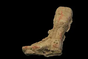 Stucco: Fragment of relief. It depicts the leg of the priest