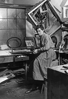 Pursue: Frame maker in her workshop, 1930