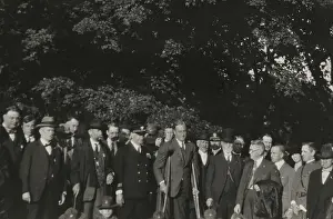 Combining: Franklin Roosevelt on crutches in a group of men