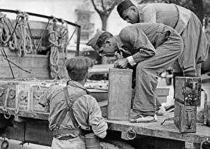 Braided: Franquista soldiers loading ammunition, 1936