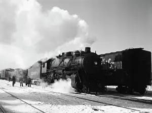 Heading: A freight train on Santa Fe railroad departing