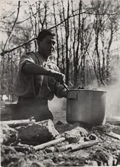 Chef: French boy scout cooking at camp