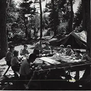 Trestle: French boy scouts enjoying meal at camp