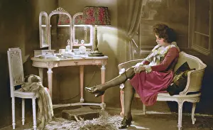 Garters: French lady getting ready to go out in her boudoir