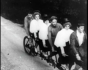 Tandem: French People Riding Tandem Bicycle Down A Road