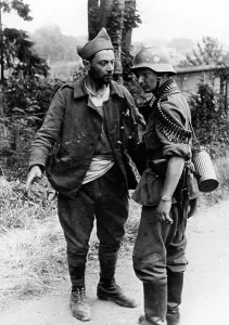 Infantryman: French prisoner with a German soldier, 1940