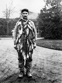 Rats: A French soldier with dead rats