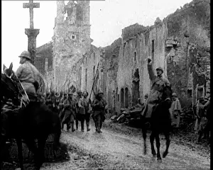 French Soldiers Marching Through A Destroyed Town