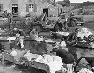 Jeeps: French village women doing their share their laundry