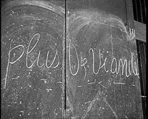 French Words Written in Chalk on a Wall
