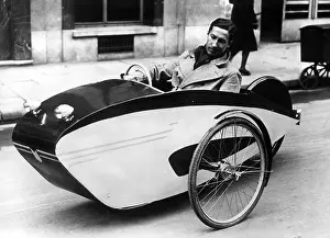 Stimulated: Frenchman in a pedal car, 1941