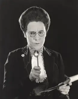 Grimacing: Frowning woman with notepad