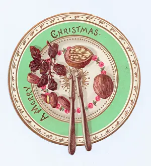 Raisins: Fruit and nuts on a plate on a cutout Christmas card