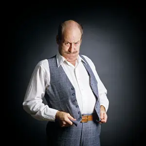 Paunch: Frustrated Overweight Middle-Aged Man Holding
