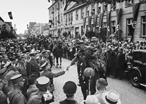 Though: A functionary (Gauleiter) of NSDAP welcomes a german officer