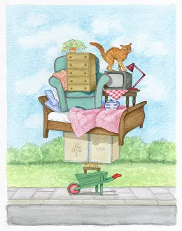 Piled: Furniture piled up on a wheelbarrow