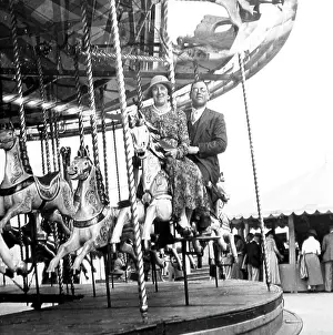 Gallopers: Gallopers ride at a fair, probably 1940s