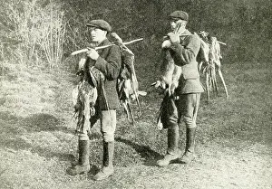 Keepers: Two gamekeepers carrying pheasants and hares