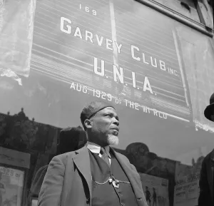 Storefront: A Garveyite in front of the Garvey Club ?