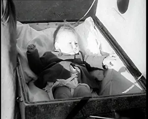 Proof: A Gas Proof Pram With the Lid Open and a Baby