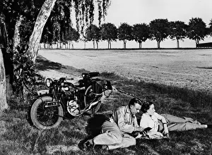 Fringes: Gateway with motorcycle, 1935