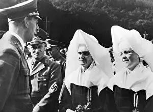 Nuns: Gauleiter (District leader) Hoffmann awards the War Service