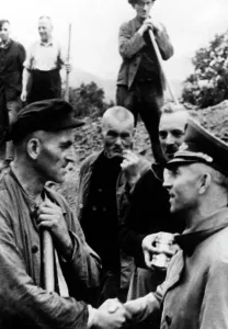 Commissioner: Gauleiter Gustav Simon and construction workers on the