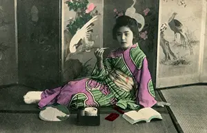 Matting: Geisha seated before a folding screen featuring cranes