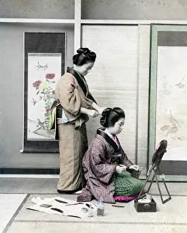 Geishas doing their hair