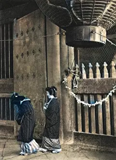 Geisha: Two Geishas walk outside a temple