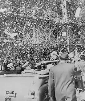 Adulation: Gen. Douglas MacArthur sitting in the rear of