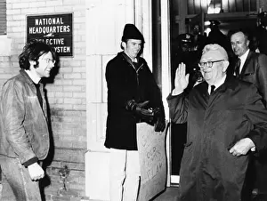 Protester: Gen. Lewis Hershey waves to protesters outside
