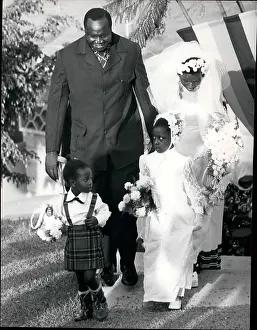 Deference: General Amin of Uganda with bride and two children