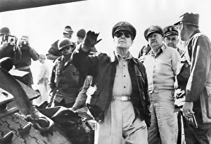 Fatigues: General Douglas MacArthur inspecting troops in
