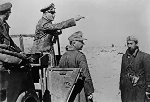 Bsloclcgr: General Rommel standing in jeep in the North African