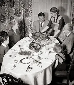 Grandparent: Three Generation Family Sitting Around Dining