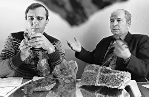 Geologists analyze samples of minerals, 1988