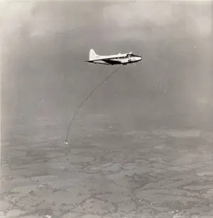 Towed: A geophysical survey ~bird towed by de Havilland DH104 Dove
